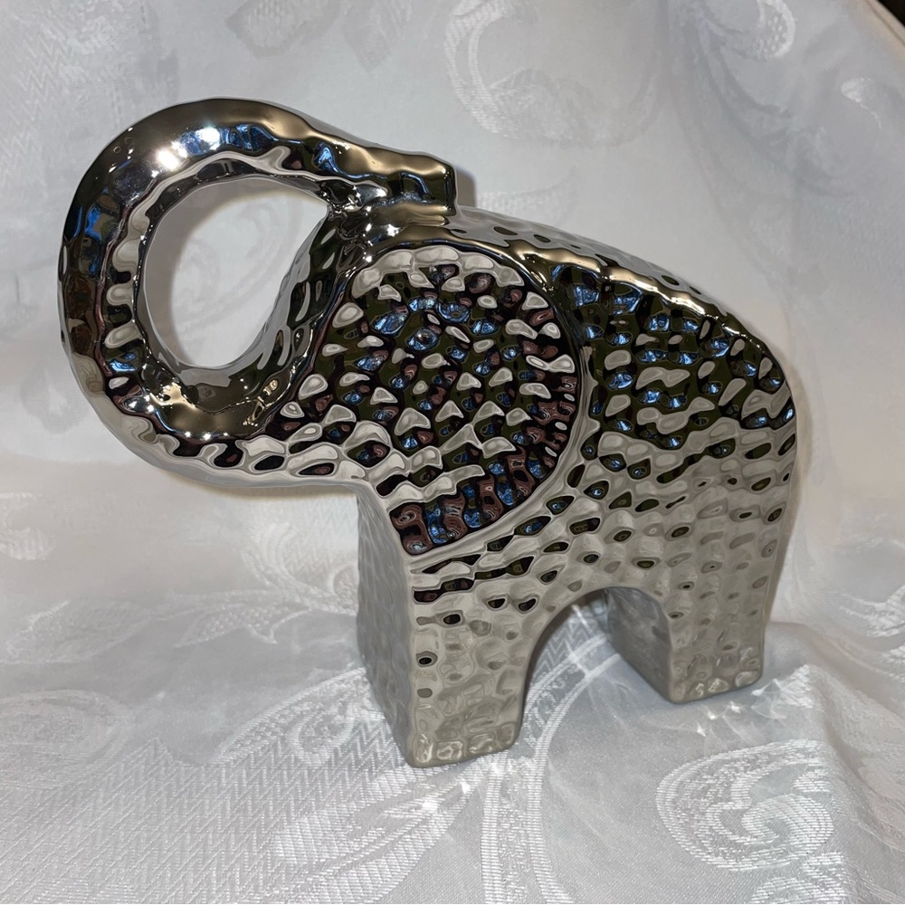Elephant trunk up for good luck. Unique dimpled metal by Three Hands Corp.